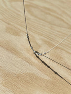 Close-up of MCJ anti-tarnish silver Morse code necklace highlighting the 4mm dots and dashes handcrafted in Jaipur