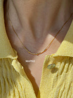 MCJ custom gold Morse code jewelry spelling Mateo, styled as a minimalist everyday name necklace handcrafted in Jaipur